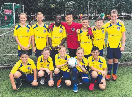  ??  ?? The Gold Coast Football Academy under-11 side (above and below) at the Singapore Cup. Pictures: SAM SMITH