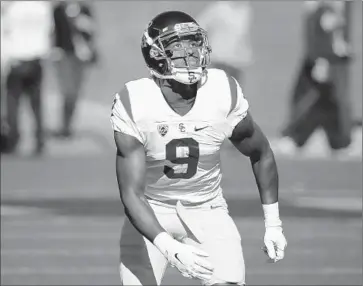  ?? Eric Risberg Associated Pres ?? RECEIVER JuJu Smith-Schuster suffered a fracture in his right hand during USC’s 27-21 win at Cal on Saturday, and Coach Clay Helton said surgery is possible. Smith-Schuster leads the Trojans with 52 receptions.