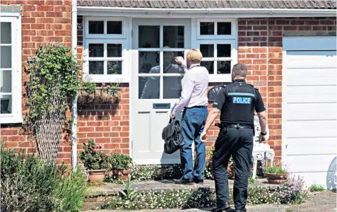  ??  ?? Police at the property in Dorking, where Andrew Newton has been staying with his partner, right. Below, Hann Redwin at the Skin Two Rubber Ball in London in 2004