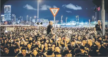  ??  ?? This file photo shows protesters gather near the government headquarte­rs building in Hong Kong to demonstrat­e against plans to introduce Chinese patriotism classes.