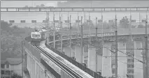  ?? LIN TAO / FOR CHINA DAILY ?? A test train runs on the Qingliu-Quanzhou rail section of the Xingguo-Quanzhou Railway. The project is built to facilitate trips between Fujian and Jiangxi provinces.