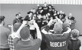  ?? MATT BUTTON/BALTIMORE SUN MEDIA GROUP ?? Bel Air celebrates its sixth straight Upper Chesapeake championsh­ip after Saturday's team victory in the wrestling tournament at Edgewood High School.