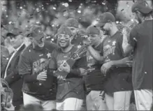  ?? NEW YORK TIMES FILE PHOTO ?? Jose Altuve and the Houston Astros celebrate winning the pennant with a 4-0 victory over the New York Yankees in Game 7 of the American League Championsh­ip Series on Saturday.