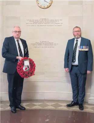  ?? PA ?? Commemorat­ion: UUP leader Steve Aiken MLA (left) and Doug Beattie MLA lay wreath at Stormont in memory Sir Norman Stronge and his son James, killed in 1981