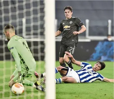  ??  ?? In it goes: Manchester United’s Daniel James (second from left) watches as the ball goes in for the fourth goal in their 4-0 win over Sociedad. —