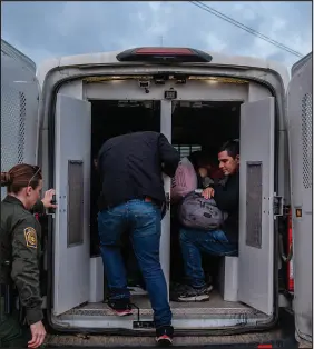  ?? ?? Border Patrol agents take in asylum-seekers who had recently arrived in the backcountr­y wilderness. Finally reaching California was a welcome relief for the migrants who made the trek.