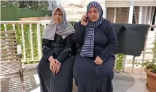  ?? ?? Palestinia­ns Rim Abu Obeida (left) and Manal Abu Shaaban from the Gaza Strip sit on a bench in a small hotel near the Augusta Victoria Hospital in east Jerusalem.