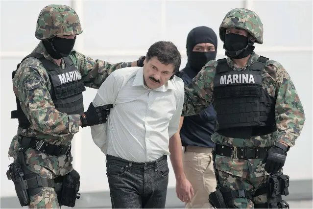  ?? EDUARDO VERDUGO/ THE ASSOCIATED PRESS FILES ?? Joaquin ‘ El Chapo’ Guzman, seen being escorted by Mexican navy marines in Mexico City in February, will face multiple federal drug traffickin­g indictment­s in the U. S.