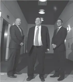  ?? CHRISTINNE MUSCHI FOR NATIONAL POST ?? Gerald Shtull, centre, poses with his sons Michael, left, and Jeffrey outside their offices in Montreal. Becoming successful meant sticking with Gerald Shtull’s
business plan, and following a few simple rules.