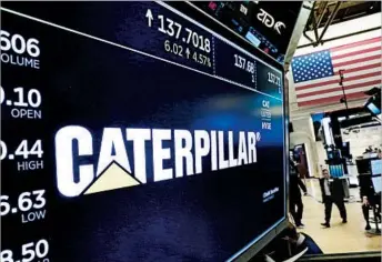  ?? RICHARD DREW/AP ?? Caterpilla­r stock gained $6.56, or 5 percent, to $138.24 Tuesday after the company posted its third-quarter report.
