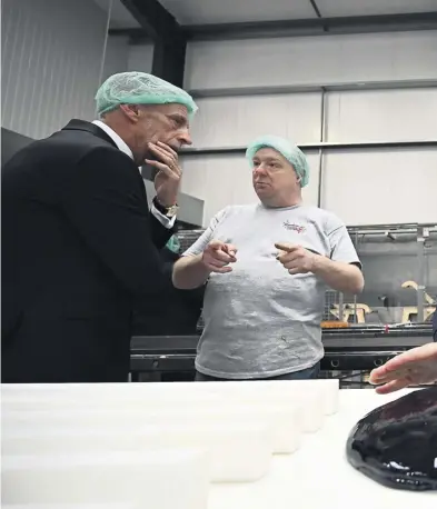  ?? PHOTOGRAPH­S: PAUL ELLIS/GETTY IMAGES; CRAIG CONNOR/NNP ?? Reform UK’s leader, Richard Tice, during a visit, with the party’s local candidate, Mark Butcher, to a confection­ery factory in Blackpool last month. Below right, Tice with Nigel Farage in Hartlepool in 2019