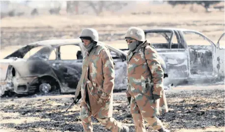  ?? | African News Agency ( ANA) Archive ?? SANDF members on patrol during hard lockdown. The defence force is a national treasure facing numerous challenges, writes the author.