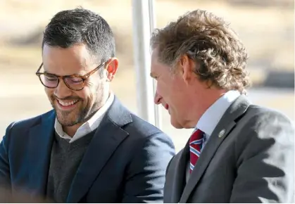  ?? STAFF PHOTO BY ROBIN RUDD ?? Mayors Weston Wamp, left, and Tim Kelly enjoy a laugh. Ground was broken Oct. 24, 2022, for the North River Commerce Center, an industrial park in Chattanoog­a.