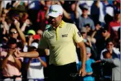  ?? ASSOCIATED PRESS ?? WEBB SIMPSON PUMPS his fist after sinking the winning putt on the first playoff hole during the final round of the Waste Management Phoenix Open on Sunday in Scottsdale.