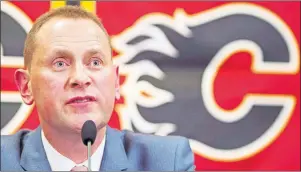  ?? CP PHOTO ?? Calgary Flames GM Brad Treliving speaks at a press conference after being introduced in Calgary, Alta. in April 2014.