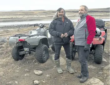  ?? THE CANADIAN PRESS FILES ?? NDP Leader Tom Mulcair chats to candidate Jack Anawak, left, during a trail ride at the Sylvia Grinnell Territoria­l Park during a campaign stop in Iqaluit, Nunavut on Sept. 29, 2015. Anawak was eight years old in 1956, the year the doctors came to his...