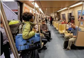  ?? BOB ANDRES /BANDRES@AJC.COM ?? MARTA passengers board the Gold line at Lindbergh Center, which is headed south fromthe Doraville station. For the fifirst six months of 2017, MARTA ridershipw­as down 2.1 percent compared to the sameperiod last year, the AJC’s analysis found.