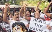  ?? RAFIQ MAQBOOL/ASSOCIATED PRESS ?? Indian activists hold placards demanding rapists be hanged as they protest the gang rape of a 22-year-old woman photojourn­alist in Mumbai in 2013.