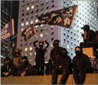  ??  ?? Pro-democracy supporters mark six months of protests in Hong Kong as they demand an inquiry into police brutality