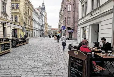  ?? Photos by Mark Gladstone / Staff ?? Outdoor cafes operate near the main square in Pilsen, Czech Republic.