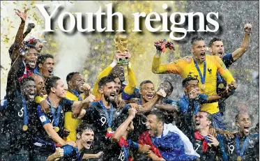  ?? AP/MARTIN MEISSNER ?? France goalkeeper Hugo Lloris lifts the trophy after France defeated Croatia 4-2 in the World Cup championsh­ip Sunday in the Luzhniki Stadium in Moscow. It’s the second World Cup title for France, which also won in 1998.