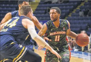  ?? T.J. COLELLO/CAPE BRETON POST ?? Duke Mondy led the Cape Breton Highlander­s with 24 points, 10 rebounds and six assists, but his team fell 106-98 to the St. John’s Edge to open their 2017-18 National Basketball League of Canada season on Tuesday at Centre 200.