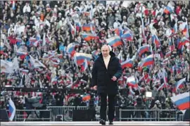  ?? Mikhail Klimentyev Pool Photo ?? PRESIDENT Vladimir Putin attends a Moscow rally on March 18 to deliver a speech marking the eighth anniversar­y of Russia’s annexation of Crimea.
