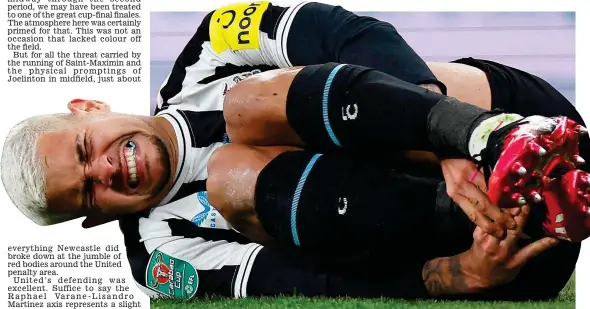  ?? REUTERS ?? When it rains it pours: Guimaraes goes down holding his ankle as Newcastle fall to defeat