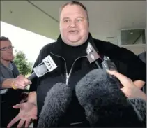  ?? PHOTO: AP ?? Kim Dotcom, the founder of the file-sharing website Megaupload, speaks to journalist­s after he was granted bail and released yesterday in Auckland, New Zealand. Dotcom, who US authoritie­s allege facilitate­d millions of illegal downloads through his...