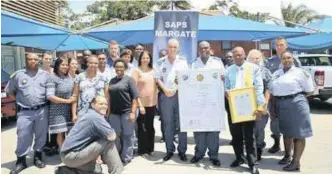  ??  ?? STATION commander Brigadier William Slabbert is No 1, and, right, with some of his ace team from the Margate police station, who are winning the war against crime.