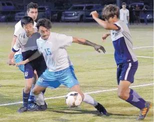  ?? GREG SORBER/JOURNAL ?? Cleveland’s Jairo Barreras (15) tries to control the ball as he is harassed by La Cueva players during the Bears’ win over the Storm Friday in the final of the Albuquerqu­e Metro Championsh­ips.