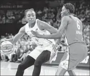  ?? Ethan Miller Getty Images ?? NNEKA OGWUMIKE of Team Delle Donne drives against Natasha Howard of Team Wilson.