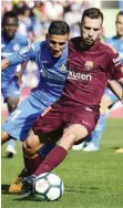  ??  ?? GETAFE: Barcelona’s defender from Spain Jordi Alba (R) vies with Getafe’s midfielder from Morocco Faycal Fajr (L) during the Spanish league football match Getafe CF vs FC Barcelona at the Col. Alfonso Perez stadium in Getafe yesterday. — AFP