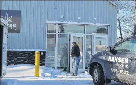  ?? ERIC MCCARTHY/JOURNAL PIONEER ?? A constructi­on worker arrives at the P.E.I. Cannabis Corporatio­n’s O’Leary store. Contractor­s and subcontrac­tors are wrapping up their efforts in anticipati­on of a late January opening of the store. The store will open more than three months later than the corporatio­n’s other three corporate stores in P.E.I.