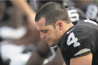  ?? Carlos Avila Gonzalez / The Chronicle ?? Derek Carr is shown on the bench before the final series for the Raiders against the Chargers.