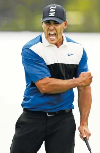  ?? AP PHOTO/CHARLES KRUPA ?? Brooks Koepka reacts after sinking a putt on the 18th green to win the PGA Championsh­ip on Sunday at Bethpage Black in Farmingdal­e, N.Y. After dominating in the first three rounds, he closed with a 74.