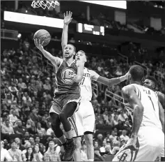  ??  ?? Golden State Warriors’ Stephen Curry shoots a layup during the third quarter against the Houston Rockets at Toyota Centre.