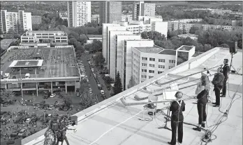  ?? MARKUS SCHREIBER/AP ?? Making music in a major key: Musicians with alp horns perform Saturday on the roof of an apartment building Saturday in Dresden, Germany. The concert came at a time when cultural events have been disrupted by the coronaviru­s pandemic. Germany has recorded almost 261,000 confirmed coronaviru­s cases, according to Johns Hopkins University.