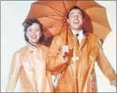  ??  ?? SINGIN’ IN THE RAIN: Debbie Reynolds and Gene Kelly.