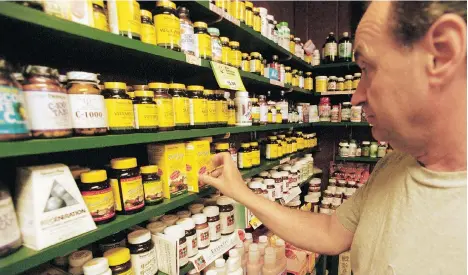  ?? DARREN MCCOLLESTE­R/GETTY IMAGES ?? An estimated 14 million Canadians take vitamins worth $370 million annually.