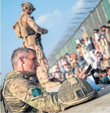  ??  ?? HARROWING: British armed forces continue to take part in the evacuation of eligible personnel from Kabul airport.