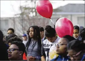  ?? REANN HUBER/REANN.HUBER@AJC.COM ?? Renfroe Middle students take part Tuesday in the vigil, which was organized by the Beacon Hill NAACP chapter, in downtown Decatur.