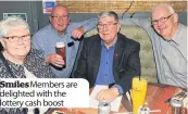  ??  ?? Smiles Members are delighted with the lottery cash boost