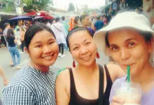  ??  ?? POSING at the Chatuchak Market in Bangkok (L-R: Angelica Tongco, Jeda Agustin, and writer Joan Mae Soco-Bantayan)