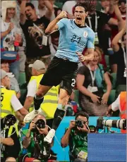  ?? FRANCISCO SECO/AP PHOTO ?? Edinson Cavani celebrates after scoring his second goal to lift Uruguay to a 2-1 win over Portugal in Saturday’s World Cup round of 16 match in Sochi, Russia.