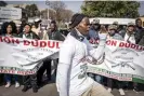  ?? ?? An anti-immigrant group protests outside the court in Krugersdor­p, South Africa, where more than 80 men detained after the alleged gang-rape and armed robbery appeared on Monday. Photograph: Shiraaz Mohamed/AP