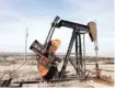  ?? — Reuters ?? An oil derrick stands above the plains north of Amarillo, Texas.