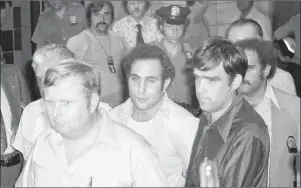  ?? AP PHOTO ?? In this August 1977 file photo, serial killer David Berkowitz, known as Son of Sam, arrives at Brooklyn Courthouse in New York. A new documentar­y on the Smithsonia­n Channel paints a portrait of the fearful, dysfunctio­nal New York City before Berkowitz...