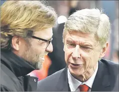  ??  ?? File photo of Liverpool manager Jurgen Klopp and his Arsernal counterpar­t during a match. — Reuters photo