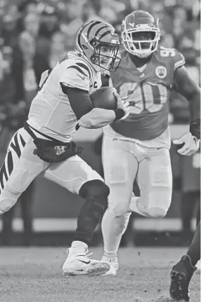  ?? REED HOFFMANN/AP ?? Bengals quarterbac­k Joe Burrow runs for yardage against the Chiefs during the second half of the AFC championsh­ip game Jan. 30 in Kansas City, Mo.